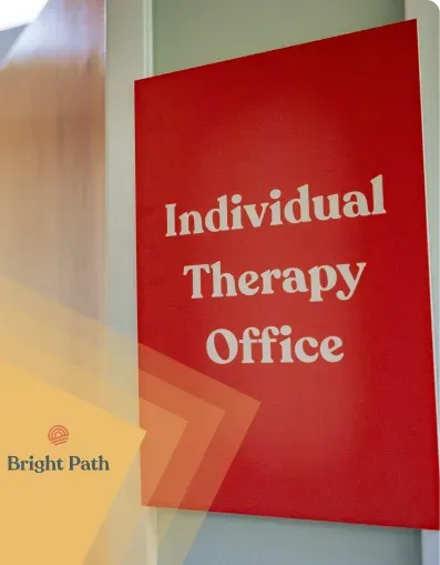Red Individual Therapy Office sign on a wall at Bright Path