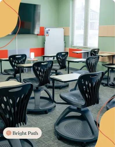 Classroom with black rolling chairs and desks at Bright Path