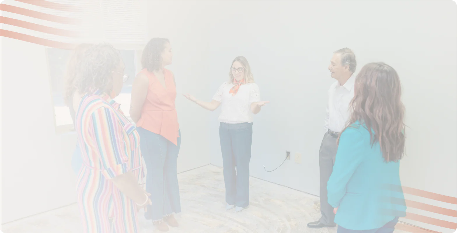 Five Bright Path Behavioral Health team members talking together in a bright room, the Bright Path team