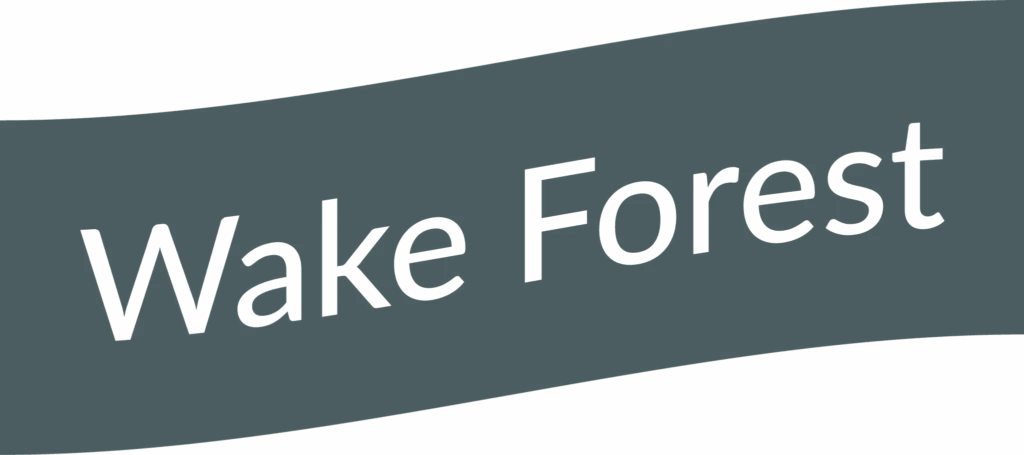 Wake Forest flag waving on bright path outdoor setting