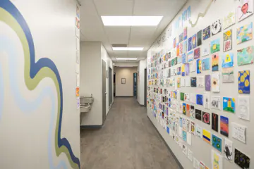 Hallway lined with teen artwork at Bright Path Wake Forest