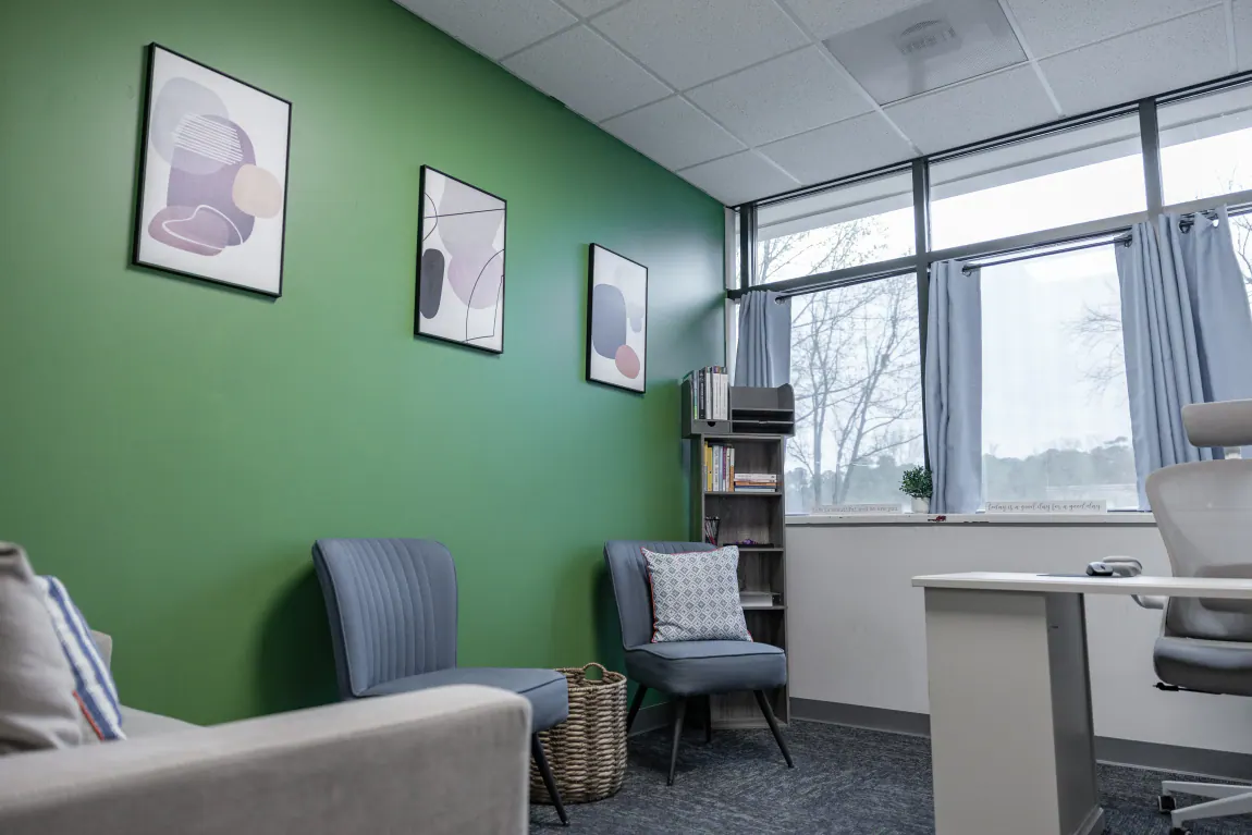 Individual therapy office with a green accent wall at Bright Path Wake Forest