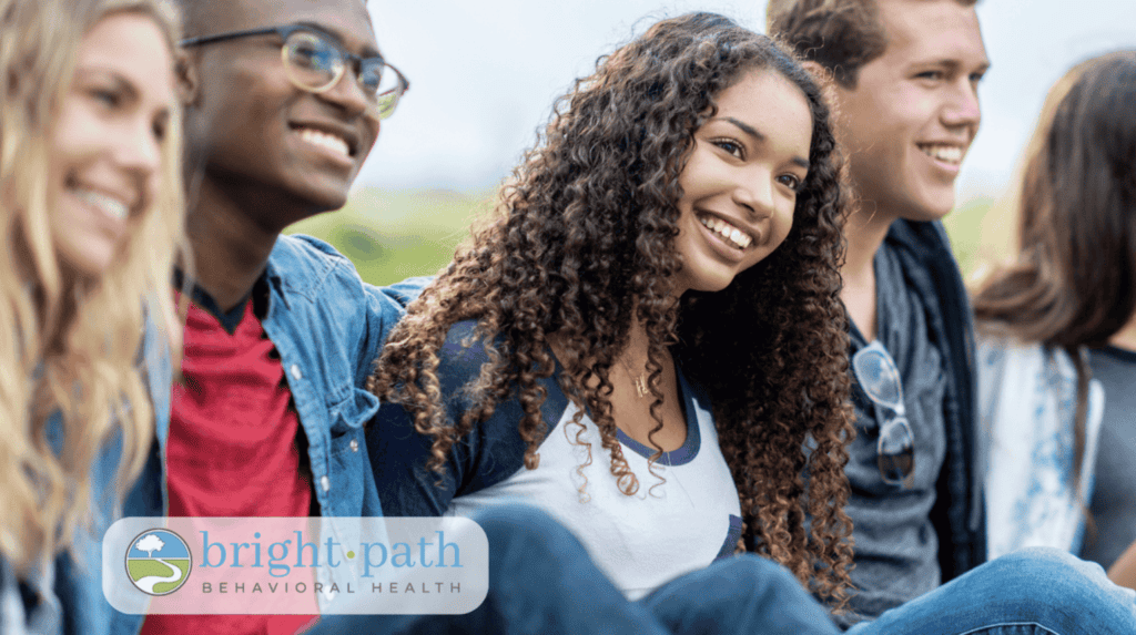 Smiling teens during an outdoor group therapy session at Bright Path Behavioral Health